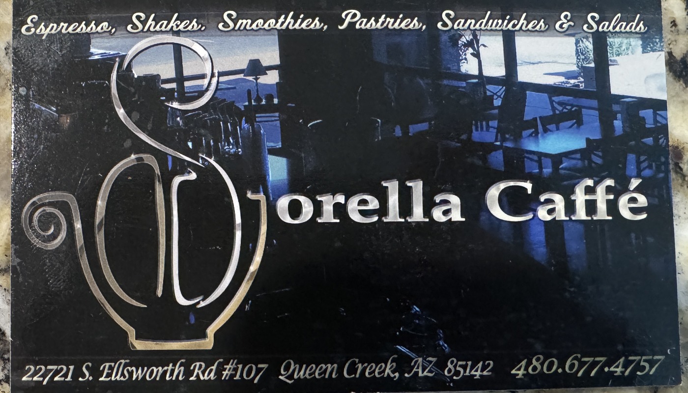 Sorella Caffé business card, 2013: silver S-and-cup monogram over a blue-lit café interior